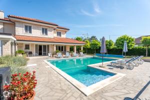 a swimming pool in the backyard of a house at Vila Eleonora Beograd in Belgrade