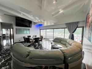 a large living room with a couch and a table at PATONG TOWER Residence Apartments 2026 in Patong Beach