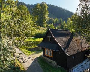a small house in the middle of a forest at Chalupka pod Kozincom - Zázrivá in Zázrivá