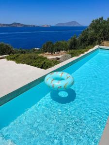 a blue swimming pool with at ARETI Horizon in Kástron