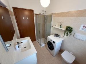 a bathroom with a toilet sink and a shower at Malpensa Stay Express Self check-in in Gallarate +29 photos