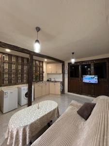 a large room with two beds and a kitchen at Lucy Apartment Goris in Goris