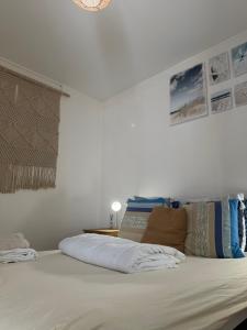 a large white bed with pillows on top of it at Bosquet in Valence