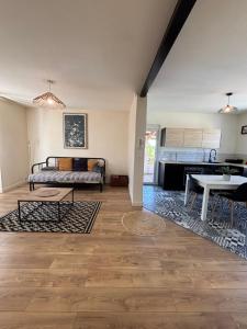 a living room with a couch and a table at Bosquet in Valence