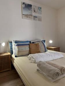 a bedroom with a large bed with pillows on it at Bosquet in Valence