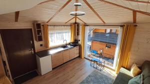 a kitchen with a sink and a counter top at Domki pod Pilskiem in Korbielów
