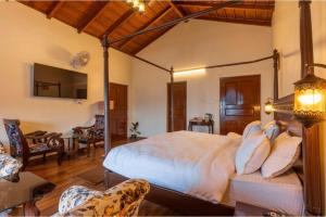 a bedroom with a large bed in a room at The Boho Mukteshwar in Mukteshwar