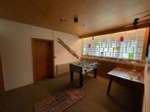 a room with a table and a window and a bench at Hotel Haus Erlen in Olsberg +8 photos