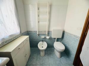 a bathroom with a toilet and a sink at Suite Semeria 44 - Sanremo in Sanremo +10 photos