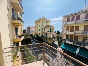 a view from a balcony of a city with buildings at Suite Semeria 44 - Sanremo in Sanremo