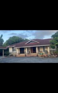 a large house with a red roof at Tokma homestay in Kuala Terengganu