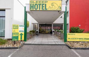 a building with a sign that reads sleep hotel at SLEEEP Hotel Vösendorf in Vösendorf
