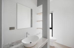 a white bathroom with a sink and a mirror at Anas house in Lipa Noi in Lipa Noi +12 photos