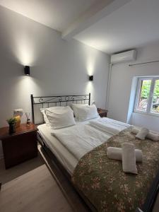 a bedroom with a large bed and a window at Miracolo di Mare Retro in Piran