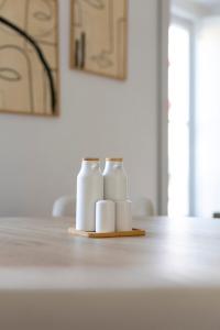three rolls of toilet paper sitting on a table at Vienna 1BR Calm & Cozy Escape in Caparica