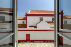 a view from an open window of a building at Vienna 1BR Calm & Cozy Escape in Caparica