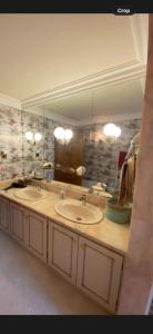 a bathroom with two sinks and a large mirror at Winterwood in Listowel +45 photos