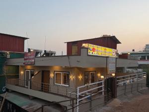 a building with a sign on the side of it at Shreya Bungalow Mahabaleshwar in Mahabaleshwar