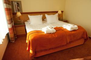 Postel nebo postele na pokoji v ubytování Hotel Amadeus
