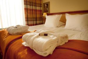 Postel nebo postele na pokoji v ubytování Hotel Amadeus