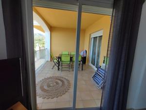 a view of a balcony with a table and chairs at Sueno de Peniscola in Peniscola +11 photos