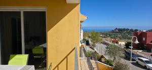 a yellow building with a view of a city at Sueno de Peniscola in Peniscola