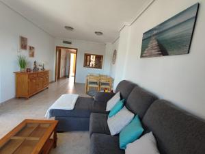 a living room with a couch and a table at Sueno de Peniscola in Peniscola