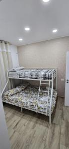a room with two bunk beds in a room at Soft landing at home in CTA +2 photos