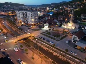 an aerial view of a city at night at Agušević Home in Novi Pazar
