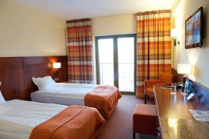 Postel nebo postele na pokoji v ubytování Hotel Amadeus