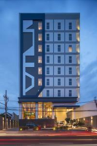 a building with a large sign on the side of it at Hotel 88 Kedungsari - Kedungdoro By WH in Surabaya