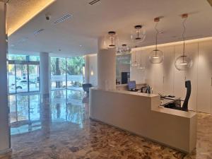 a lobby with a reception desk in a building at Hotel Castilla Alicante in Alicante +38 photos