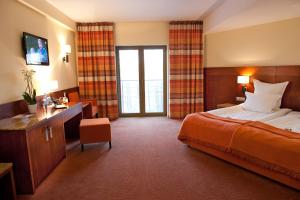 Postel nebo postele na pokoji v ubytování Hotel Amadeus