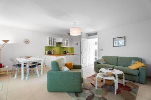 a living room with two couches and a table at Grand T2 proche plage in Six-Fours-les-Plages