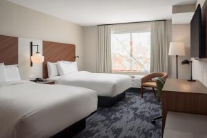 a hotel room with two beds and a window at Fairfield by Marriott Inn & Suites Cullman in Cullman +30 photos