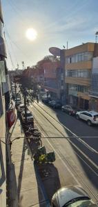 a view of a city street with cars parked at Apartamentos San Martín in San Antonio