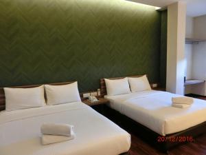 Letto o letti in una camera di D Elegance Hotel Nusajaya