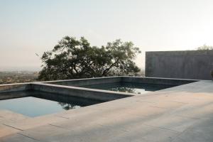 a swimming pool on the roof of a building at Casa X in San Miguel de Allende