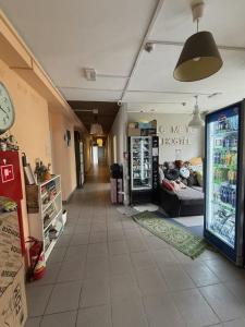 a hallway of a hospital with a store at Bazylika hostel in Warsaw