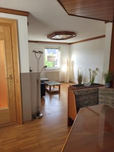 a large living room with a table and a room with at Geräumige Monteurwohnung in Mistelbach