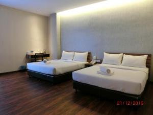 Letto o letti in una camera di D Elegance Hotel Nusajaya