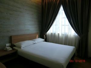 Letto o letti in una camera di D Elegance Hotel Nusajaya