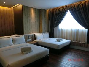 Letto o letti in una camera di D Elegance Hotel Nusajaya