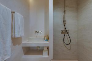 a bathroom with a sink and a shower at Quinta Javali in Aljezur