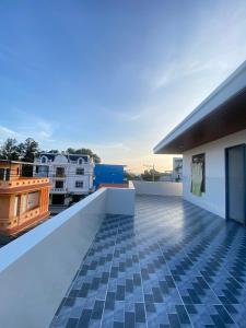 a view of the balcony of a house with a tile floor at Nhà Nghỉ THÀNH LỘC in Long Hai