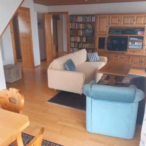 a living room with a couch and a table at Seekirchen Zentrum in Seekirchen am Wallersee