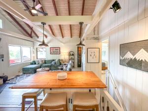 a living room with a wooden table and chairs at Chalet Valhalla wHot Tub in Sugarbush Village