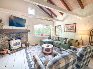 a living room with a couch and a fireplace at Chalet Valhalla wHot Tub in Sugarbush Village