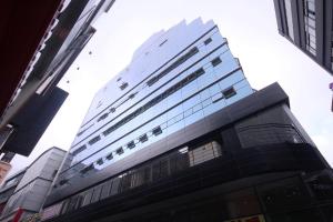 a tall building with a lot of windows at Busan Platinum Hotel Nampo in Busan +22 photos