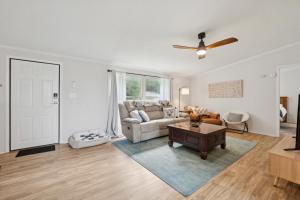 a living room with a couch and a table at The Firefly Lodge at Shenandoah in Rileyville